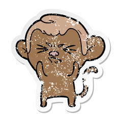distressed sticker of a cartoon annoyed monkey