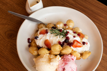 Waffle mix berries with ice cream.