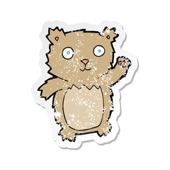 retro distressed sticker of a cartoon waving teddy bear