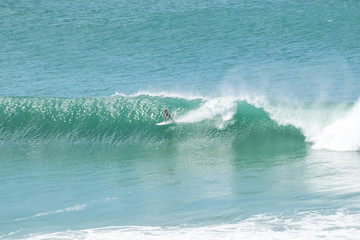 man surfer catching big wave from top of the hill at Kirra Coolangatta Queensland Gold Coast Australia 