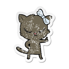 distressed sticker of a cute cartoon cat with bow