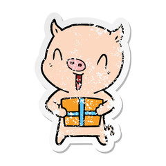 distressed sticker of a happy cartoon pig with xmas present