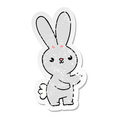 distressed sticker of a cute cartoon rabbit