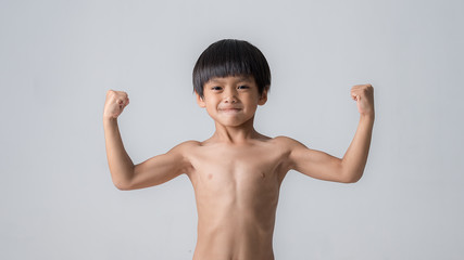 boy showing his hand biceps muscles © sutadimages