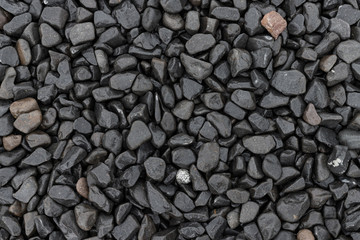 Black pebble stone background texture