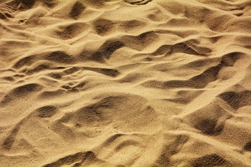closeup of sand pattern of a beach in the summer