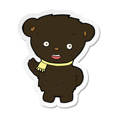 sticker of a cartoon black bear waving