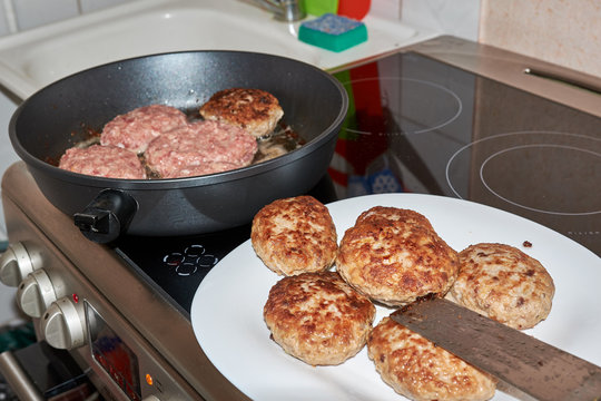 fried cooked meat patties from pork beef and chicken on a white plate standing on a table on a white towel on top of a spatula for cooking. at home. dinner.