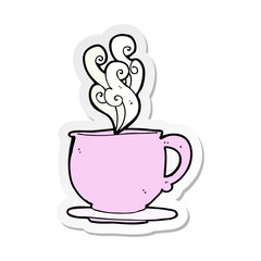 sticker of a cartoon teacup with sugar cubes