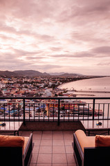 Famous Hua Hin beach and bay in evening with cityscape view from hotel sky deck
