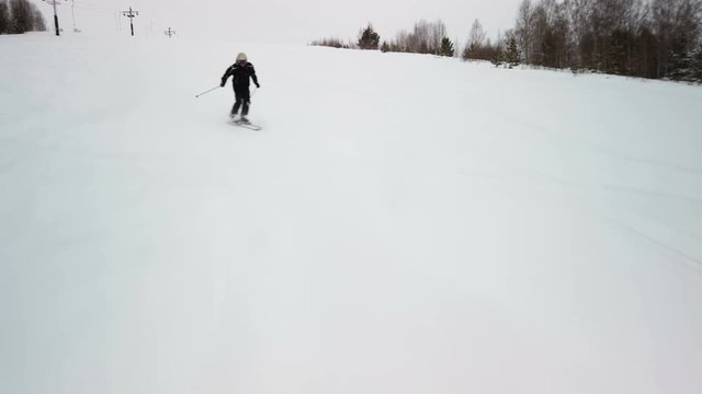 Skier going down the slope