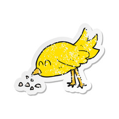 retro distressed sticker of a cartoon bird pecking seeds