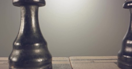 Special tracking macro shot moving between chess pieces on a chess board