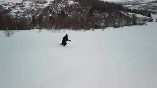 Skier going down the slope