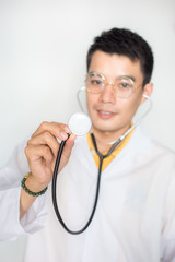 Portrait of handsome glasses asian doctor man with examining accessory