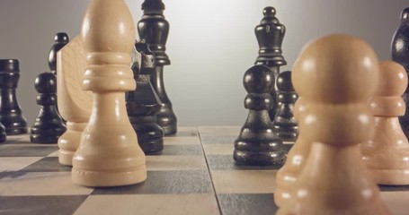 Special tracking macro shot moving between chess pieces on a chess board