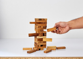 Businessman playing with the wood game