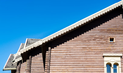 Part of the roof of the house against the blue sky