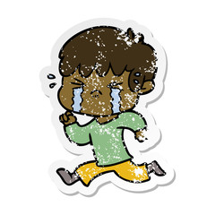 distressed sticker of a cartoon boy crying