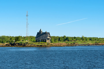 KEM, REPUBLIC OF KARELIA, RUSSIA - JUNE 24, 2018: Church decoration for the film "The Island" in the village of Rabocheostrovsk, Kem. View from the White Sea, Arkhangelsk Region, Russia