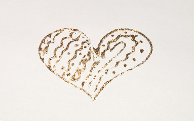 Background with glittering heart on paper in nostalgic colors, made with golden glitter