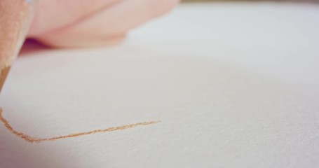 Macro shot of a colored pencil tip drawing on paper