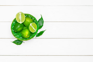 lime juice with lime slices on wooden table.