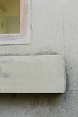 window frame on cement wall inside construction site building industry