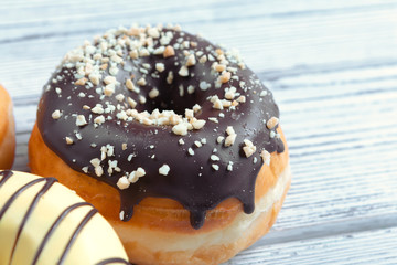 Glazed donuts on wooden background