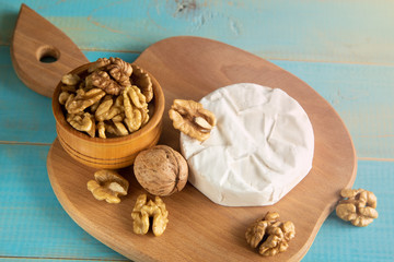 Cheese camembert or brie with walnut kernels