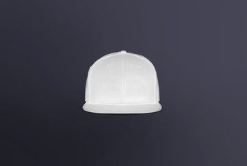 Blank cap front view. White snapback on dark background. Blank baseball snap back cap for your design. Mock up hat cap for you logo, brand identity etc.
