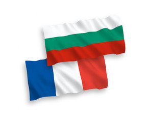 National vector fabric wave flags of France and Bulgaria isolated on white background. 1 to 2 proportion.