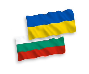 National vector fabric wave flags of Bulgaria and Ukraine isolated on white background. 1 to 2 proportion.