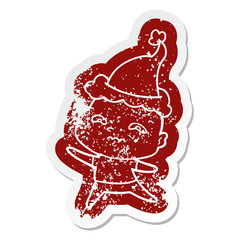 cartoon distressed sticker of a nervous man wearing santa hat