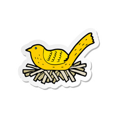 Fototapeta na wymiar sticker of a cartoon bird on nest