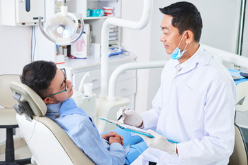Patient has a consultation in dental clinic