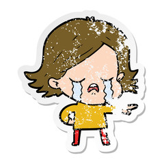 distressed sticker of a cartoon girl crying and pointing