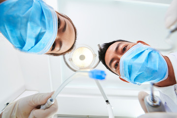 Two dentists working in clinic