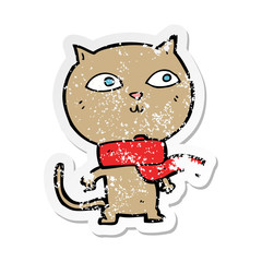 retro distressed sticker of a cartoon funny cat wearing scarf