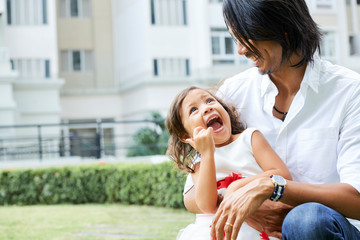 Father with little daughter outdoors