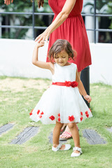 Little girl dancing with her mom
