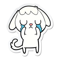 sticker of a cute cartoon dog crying