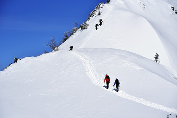 Fototapeta na wymiar Japan's mountains with snow. Trekker to the summit of Mt.Hotakayama at Gunma Prefecture. 