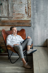 man sitting on a bench in park