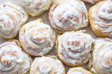 Swedish cinnamon rolls with white cream on top