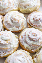Swedish cinnamon rolls with white cream on top