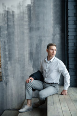 young man sitting on stairs