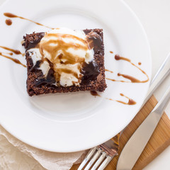 Classic chocolate dessert with a cup of coffee - brownies and ice cream