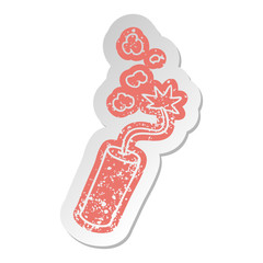 distressed old sticker of a lit dynamite stick