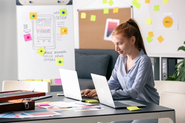 Female IT designer working in office